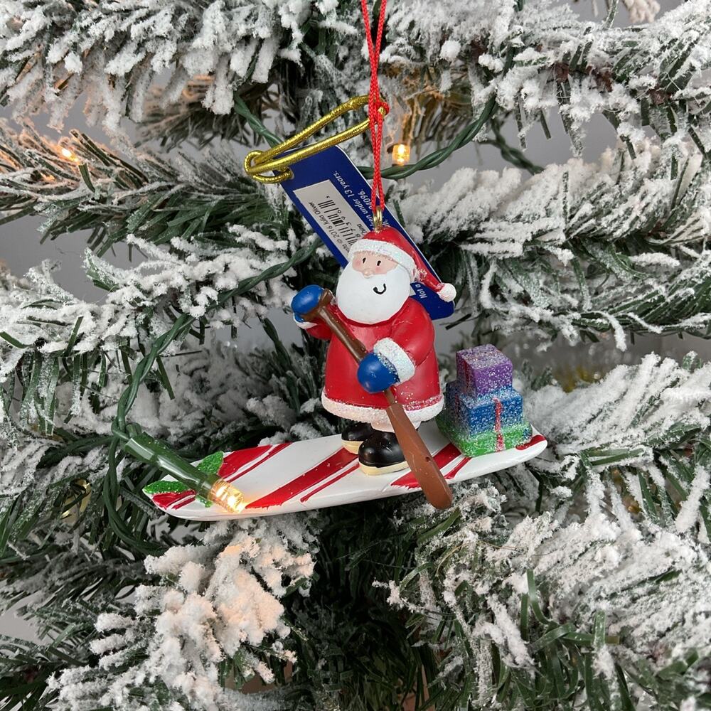 Christmas Ornament- Santa Rinding A White And Red Paddle board -Cape Shore